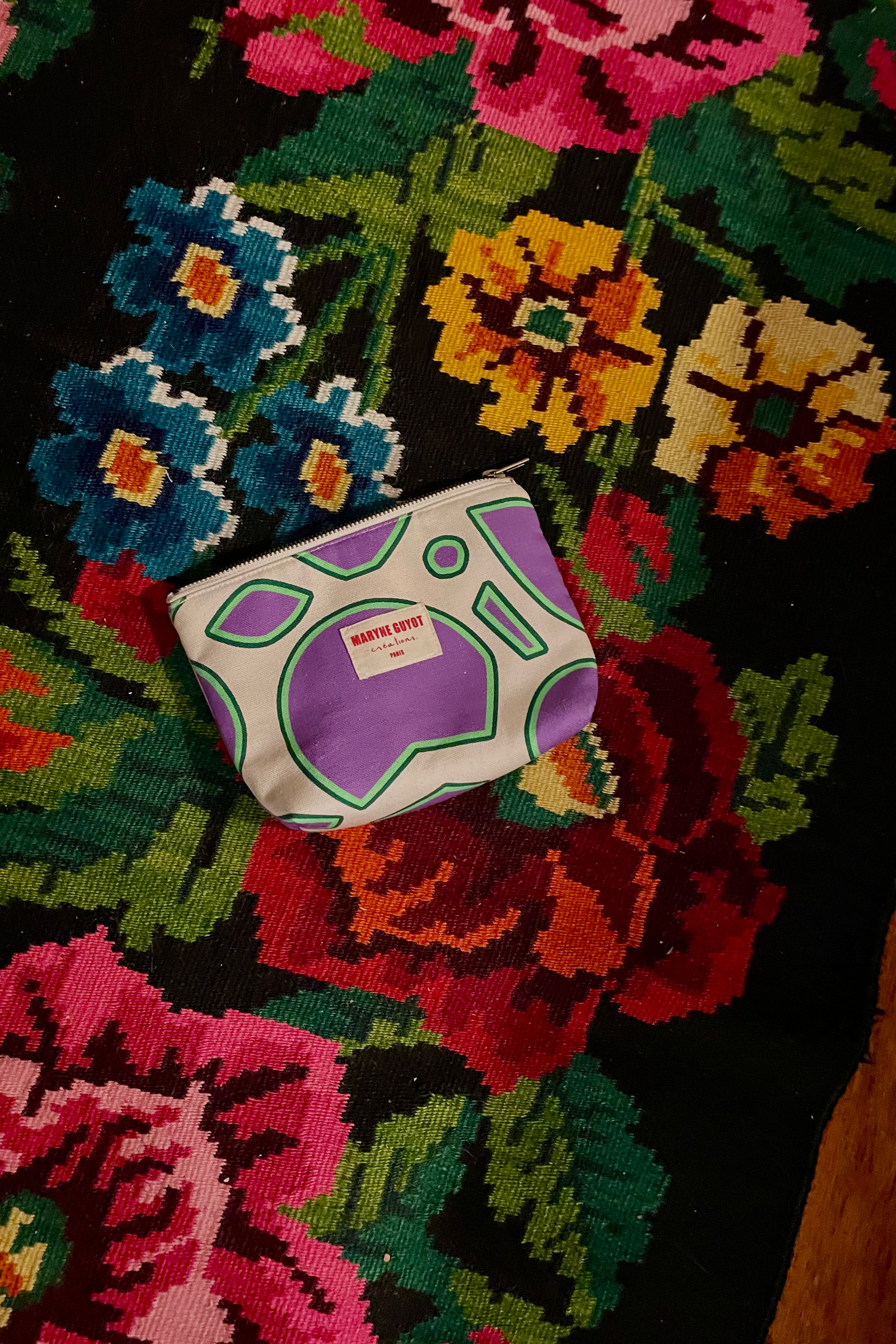 Pochette beauté motif spiral violet, beige et vert